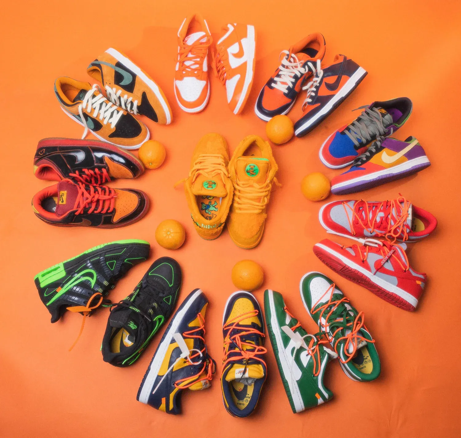 A circle of colorful sneakers on an orange backdrop